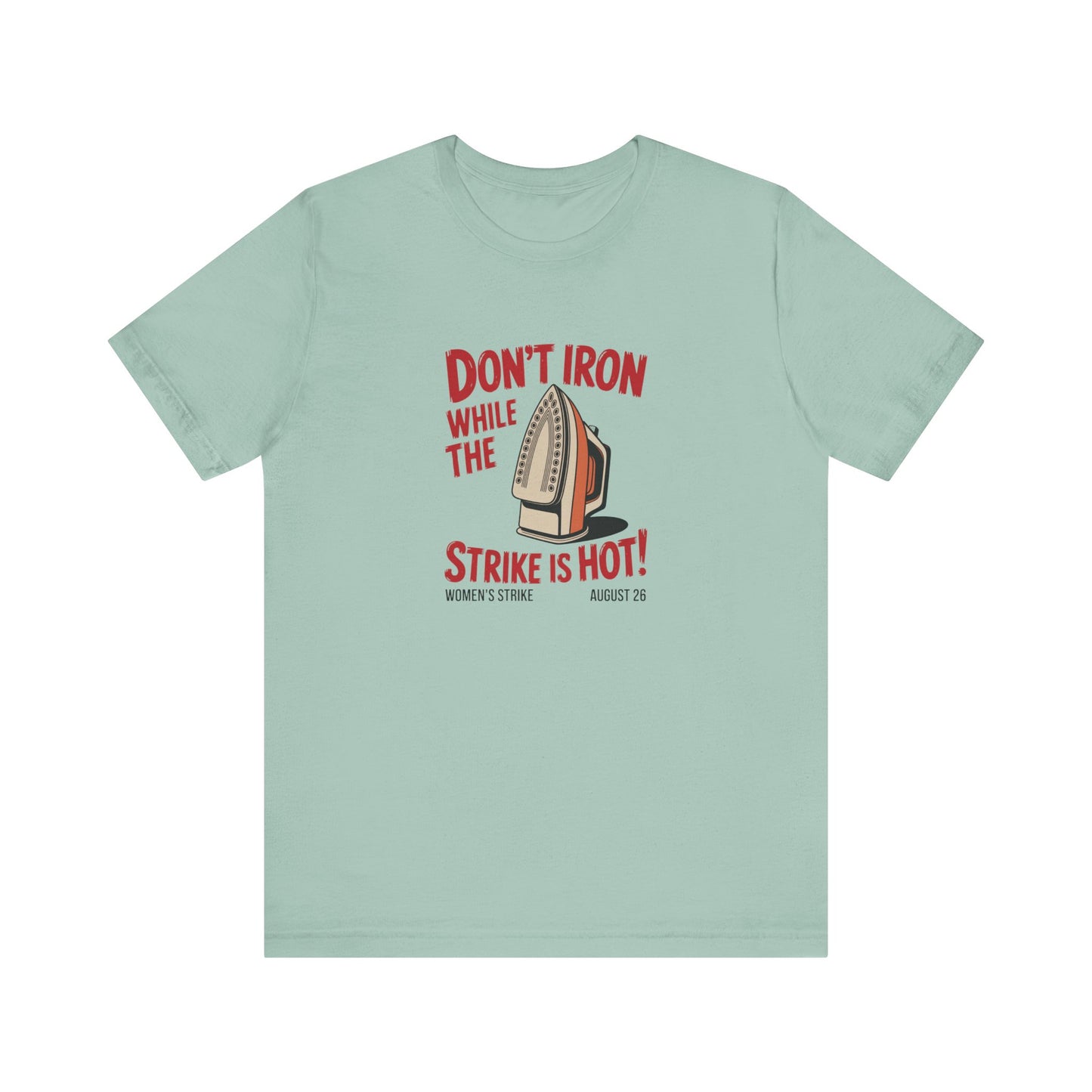 Light green t-shirt with a vintage iron graphic and red text "don't iron while the strike is hot"