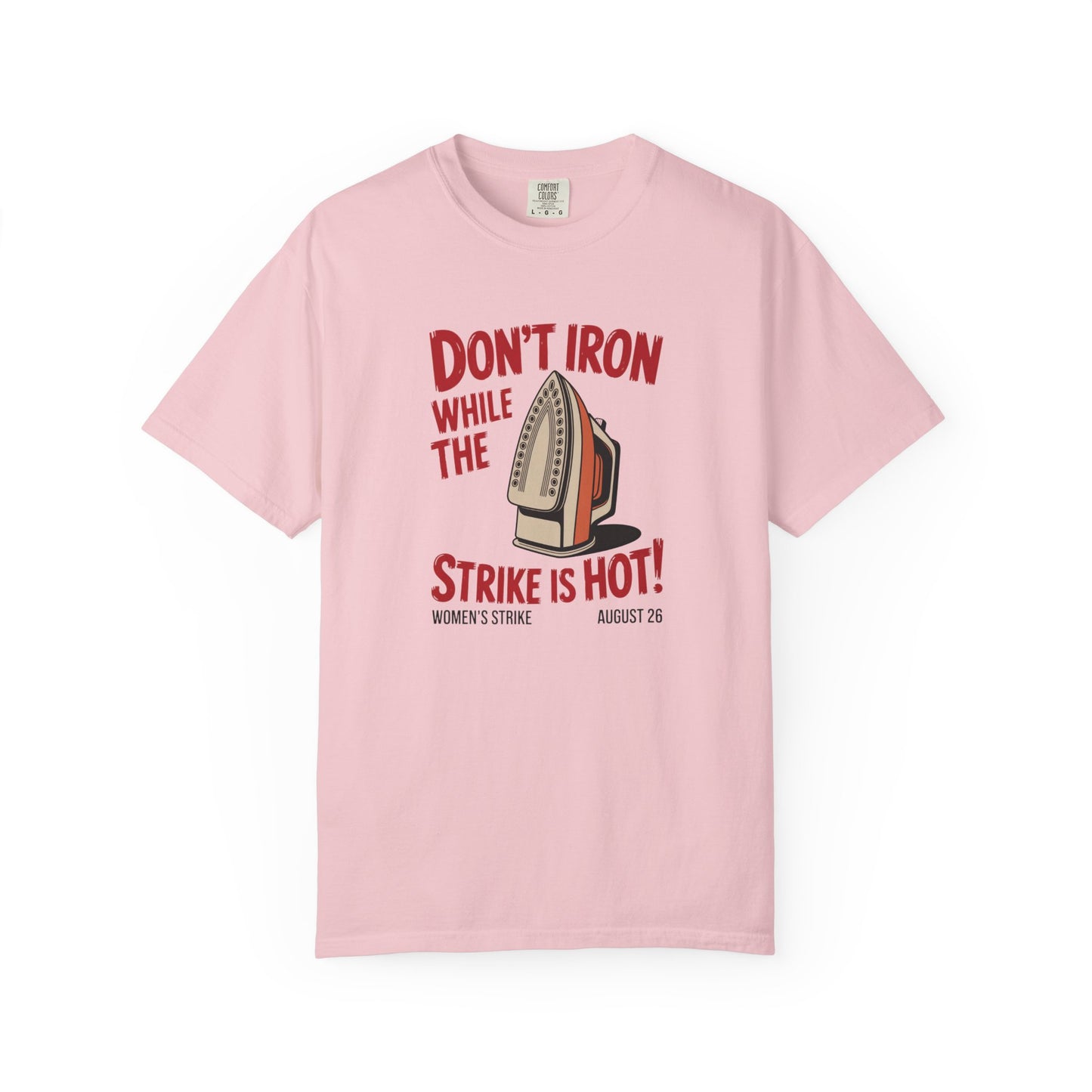 Light pink unisex Comfort Colors t-shirt with "don't iron while the strike is hot" red text and a vintage iron graphic
