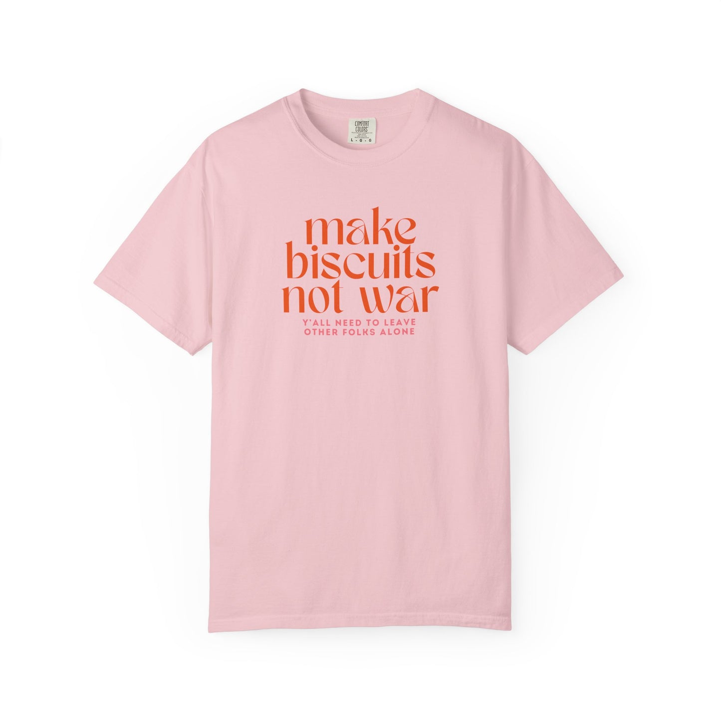 Pink t-shirt with orange text 'make biscuits not war' with smaller pink text "y'all need to leave other folks alone"
