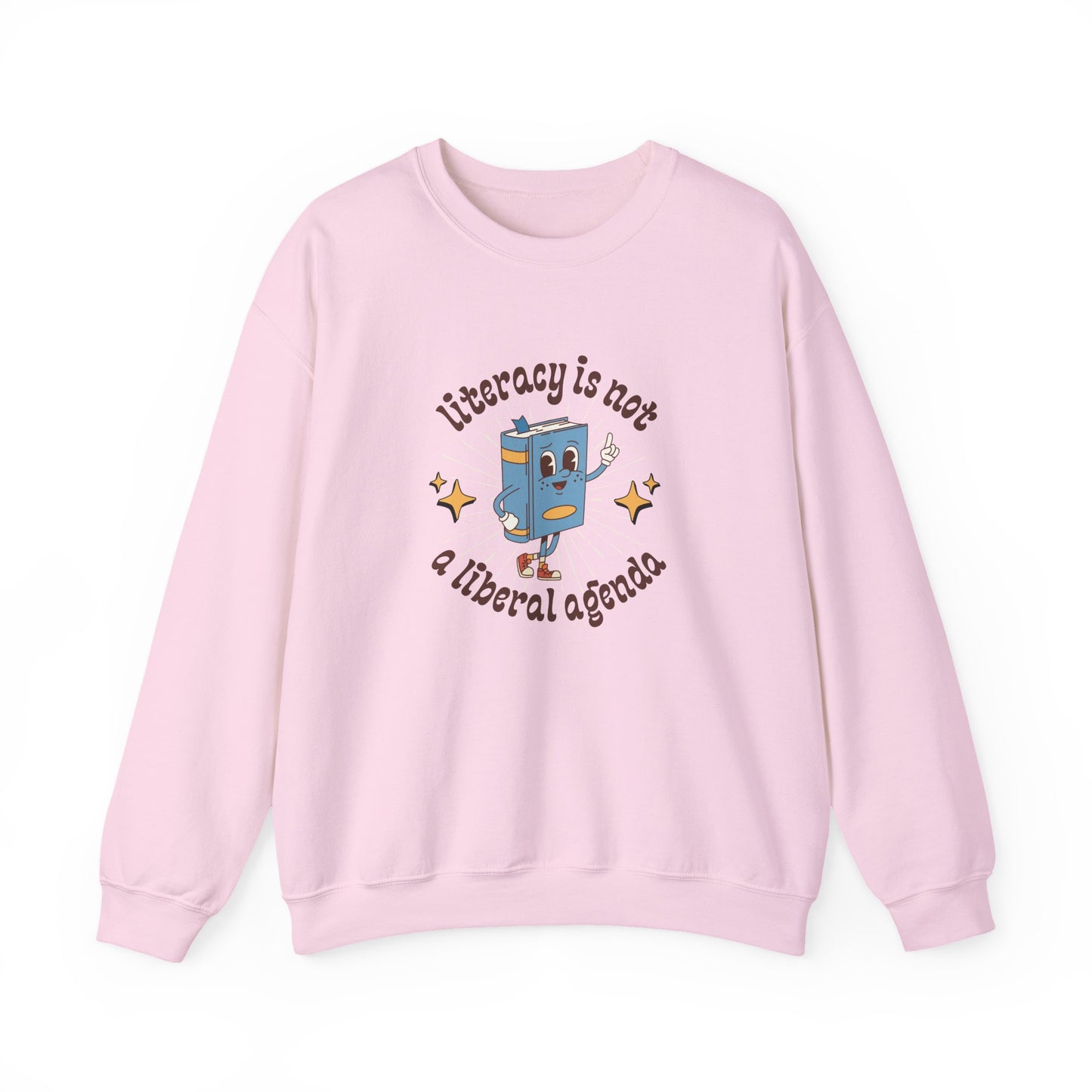 Light pink unisex crewneck sweatshirt with retro book character graphic and "literacy is not a liberal agenda" brown text