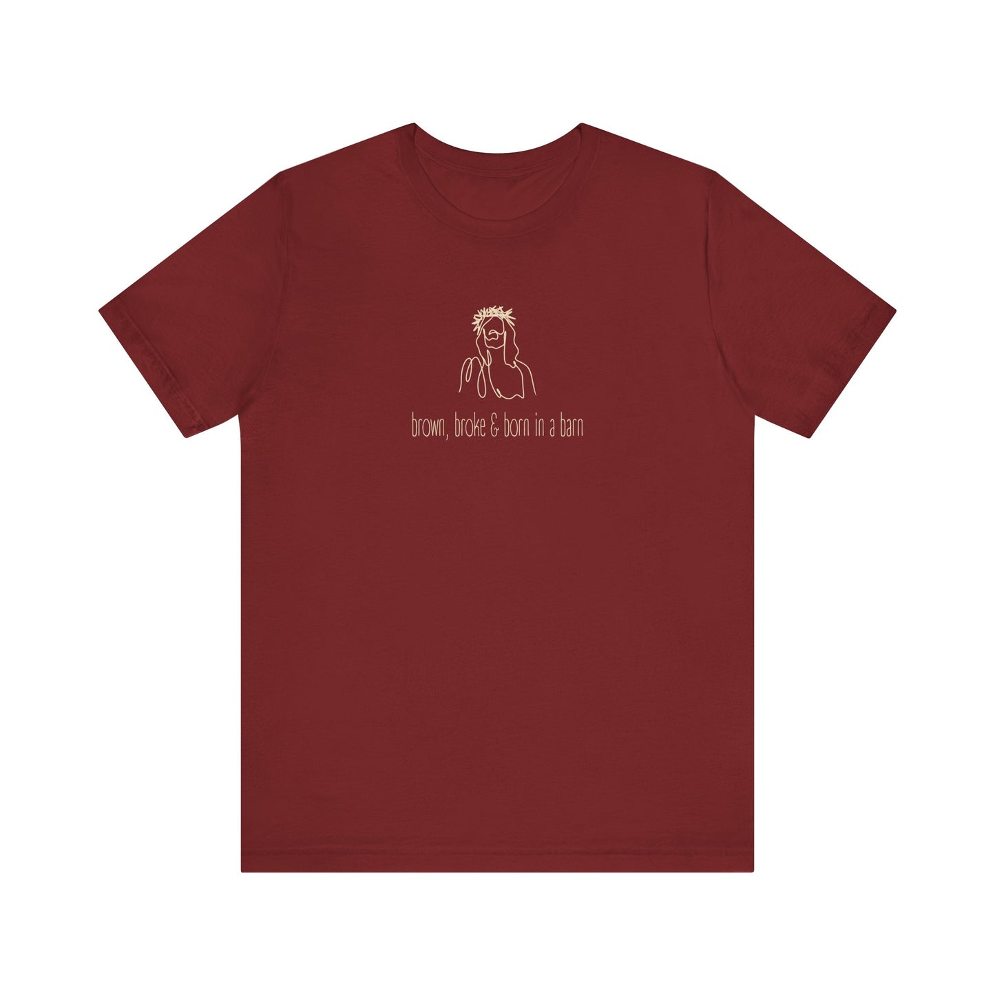 Cardinal red t-shirt with a cream sketch of Jesus graphic and cream text "brown, broke & born in a barn"