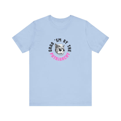 Light blue t-shirt with punk rock graphic design and black and hot pink text "grab 'em by the patriarchy"