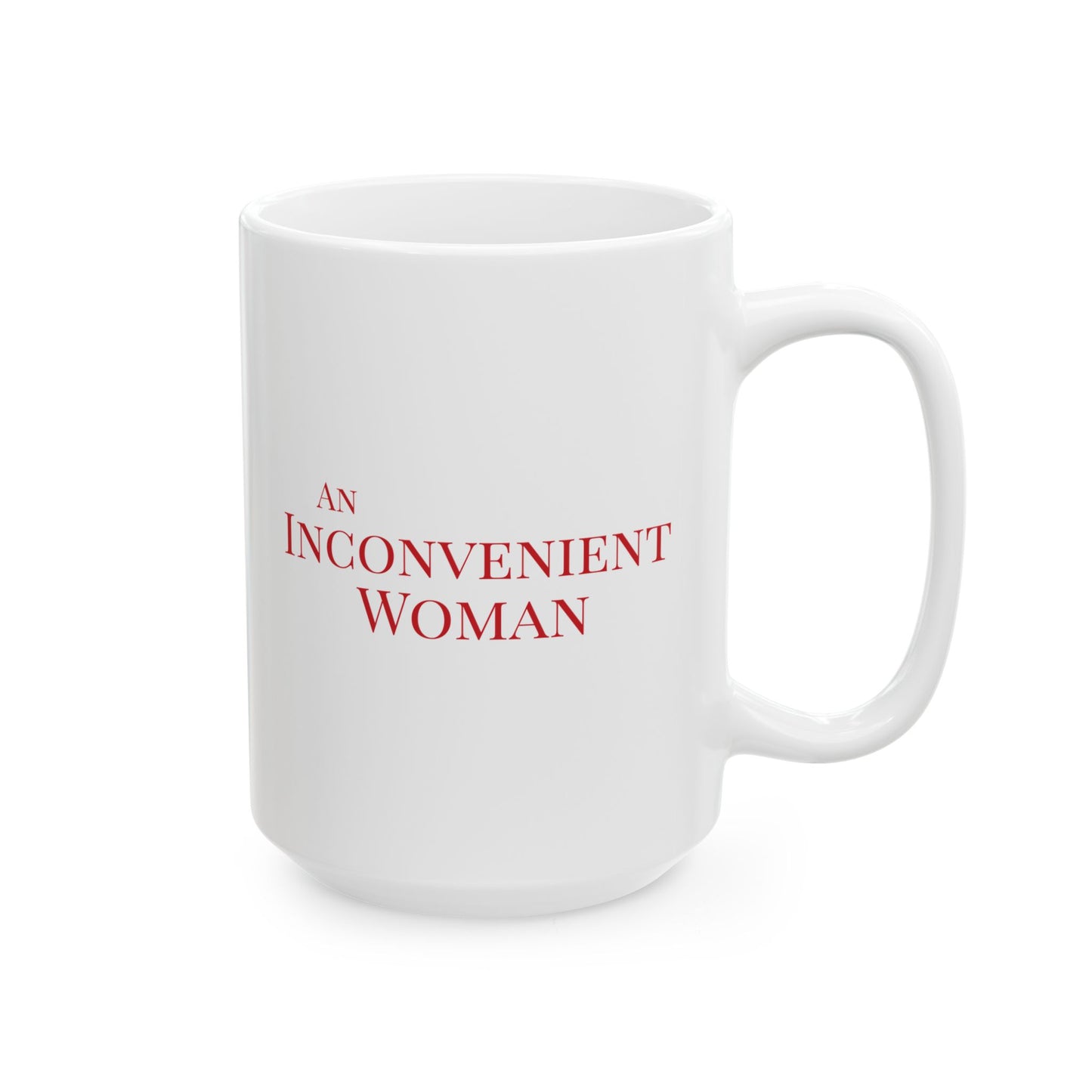 White 15 oz mug with red text 'AN INCONVENIENT WOMAN' 