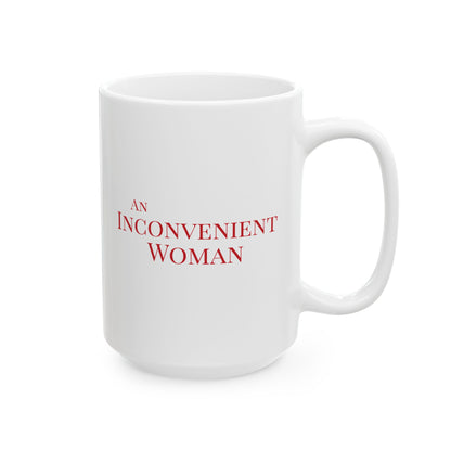 White 15 oz mug with red text 'AN INCONVENIENT WOMAN' 