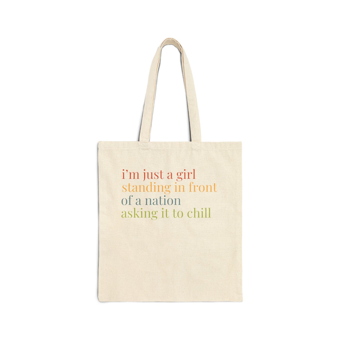 Natural tan canvas tote bag with colorful “I'm just a girl, standing in front of a nation, asking it to chill” text