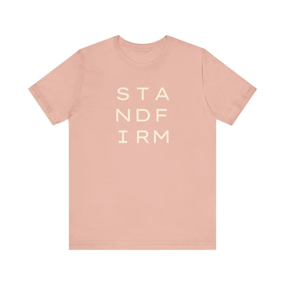 Light pink t-shirt with cream 'STAND FIRM' text 