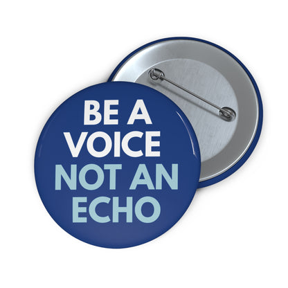 Navy blue pin button with "Be a voice, not an echo" white and light blue text