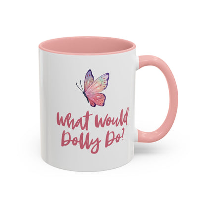 A white 11 oz ceramic mug with a pink interior, handle, and base, featuring a colorful butterfly graphic and the text 'What Would Dolly Do!' in pink script on the front.