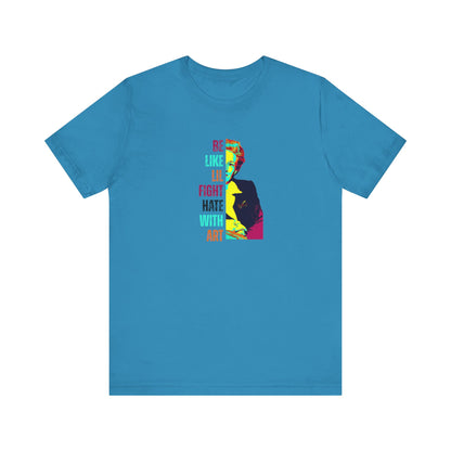 Turquoise t-shirt with colorful illustration of Lillian Smith and text "be like lil, fight hate with art"