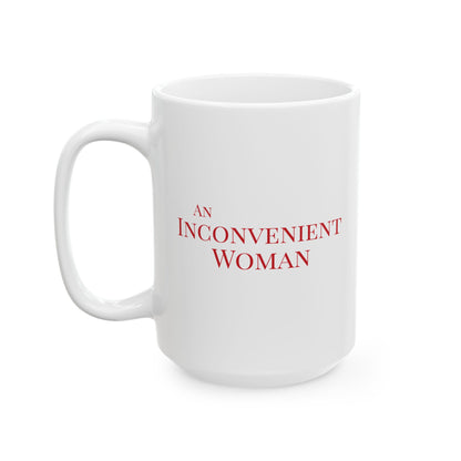 White 15 oz mug with red text 'AN INCONVENIENT WOMAN' 