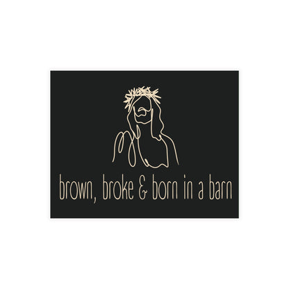 Black postcard with cream sketch of Jesus and text 'brown, broke & born in a barn'.