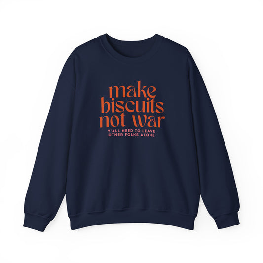 Navy blue sweatshirt with orange text "make biscuits not war" and smaller pink text underneath "y'all need to leave other folks alone"