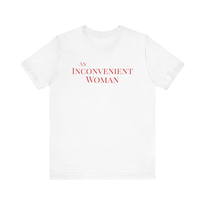 White t-shirt with red text "An Inconvenient Woman"