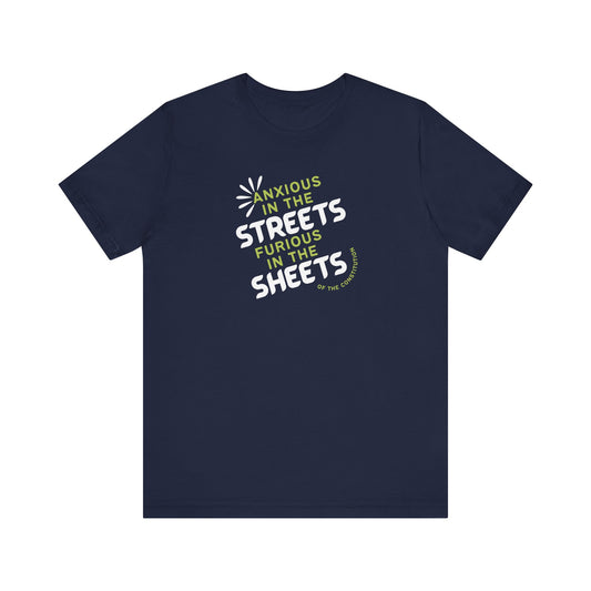 Navy blue t-shirt with white and green text "anxious in the streets, furious in the sheets (of the constitution)"