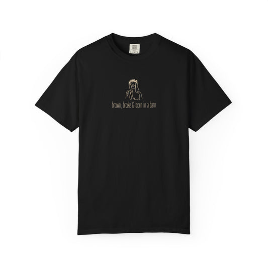 Black unisex Comfort Colors t-shirt with Jesus sketch graphic and "brown, broke & born in a barn" in cream text