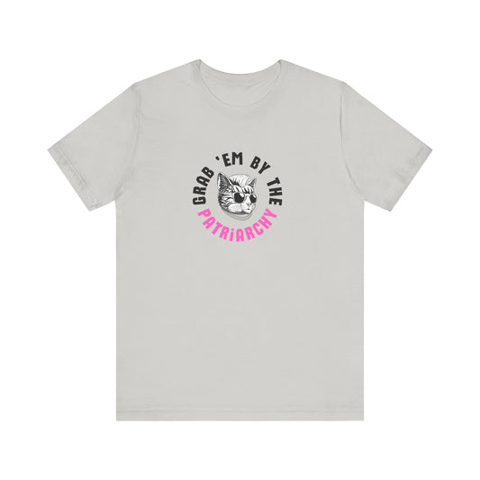 Light gray t-shirt with punk rock graphic design and black and hot pink text "grab 'em by the patriarchy"