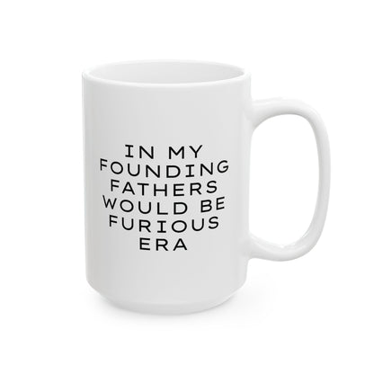 White ceramic 15 oz coffee or tea mug with "In my founding fathers would be furious era" text in black