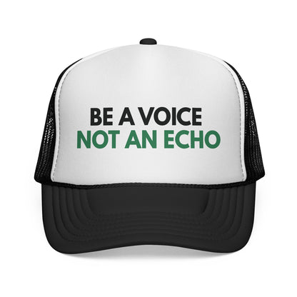 Black and white mesh trucker hat with 'Be a Voice Not an Echo' black and green text