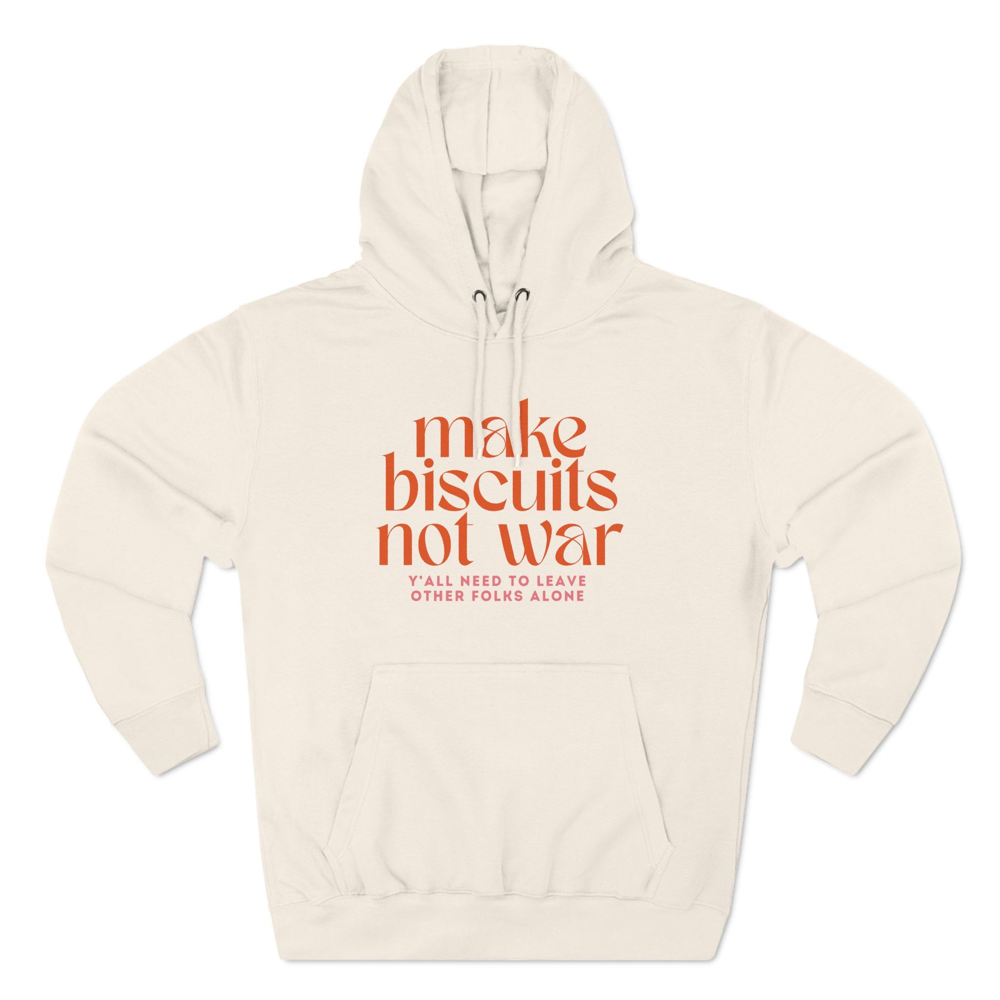 Beige hoodie with orange text 'make biscuits not war' with smaller pink text "y'all need to leave other folks alone"