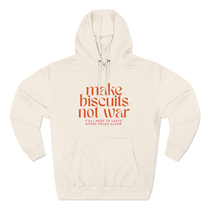 Beige hoodie with orange text 'make biscuits not war' with smaller pink text "y'all need to leave other folks alone"