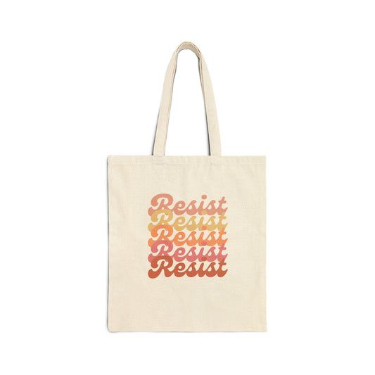 Beige canvas tote bag with 'Resist' text in a gradient of colors 