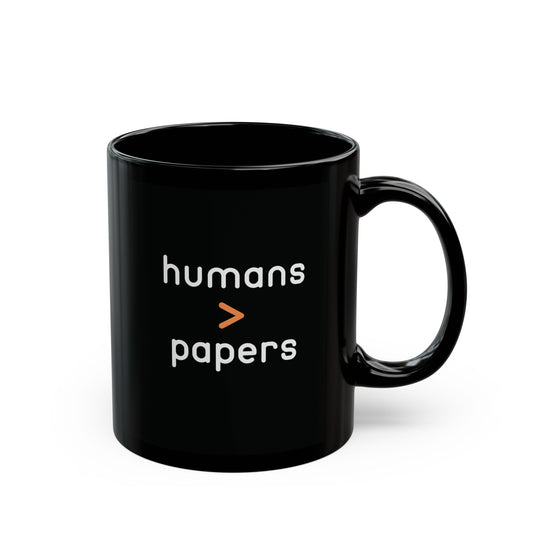 Black ceramic 11 oz coffee or tea mug with 'humans > papers' white text