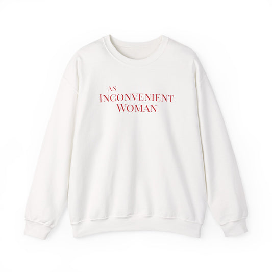 White sweatshirt with red text 'An Inconvenient Woman' 