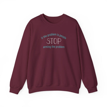 Maroon unisex crewneck sweatshirt with "if the problem is people, stop arming the problem" aqua and white text