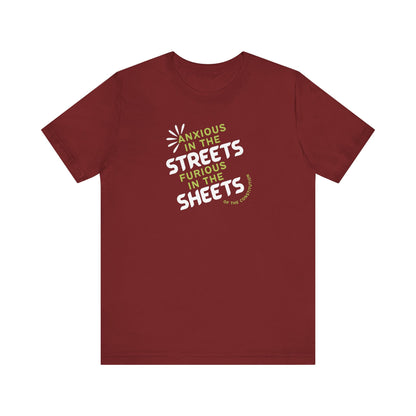 Rust t-shirt with white and green text "anxious in the streets, furious in the sheets (of the constitution)"