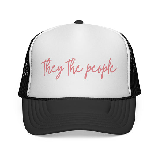 Black and white mesh trucker hat with 'They the people' text in pink 