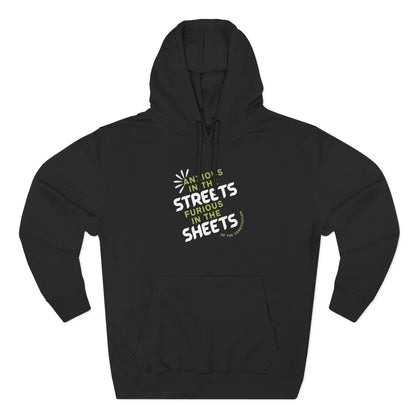 Black hoodie with "anxious in the streets furious in the sheets of the constitution" green and white text