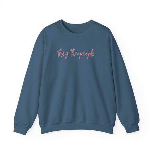 Indigo blue unisex crewneck sweatshirt with 'They the people' text in pink 