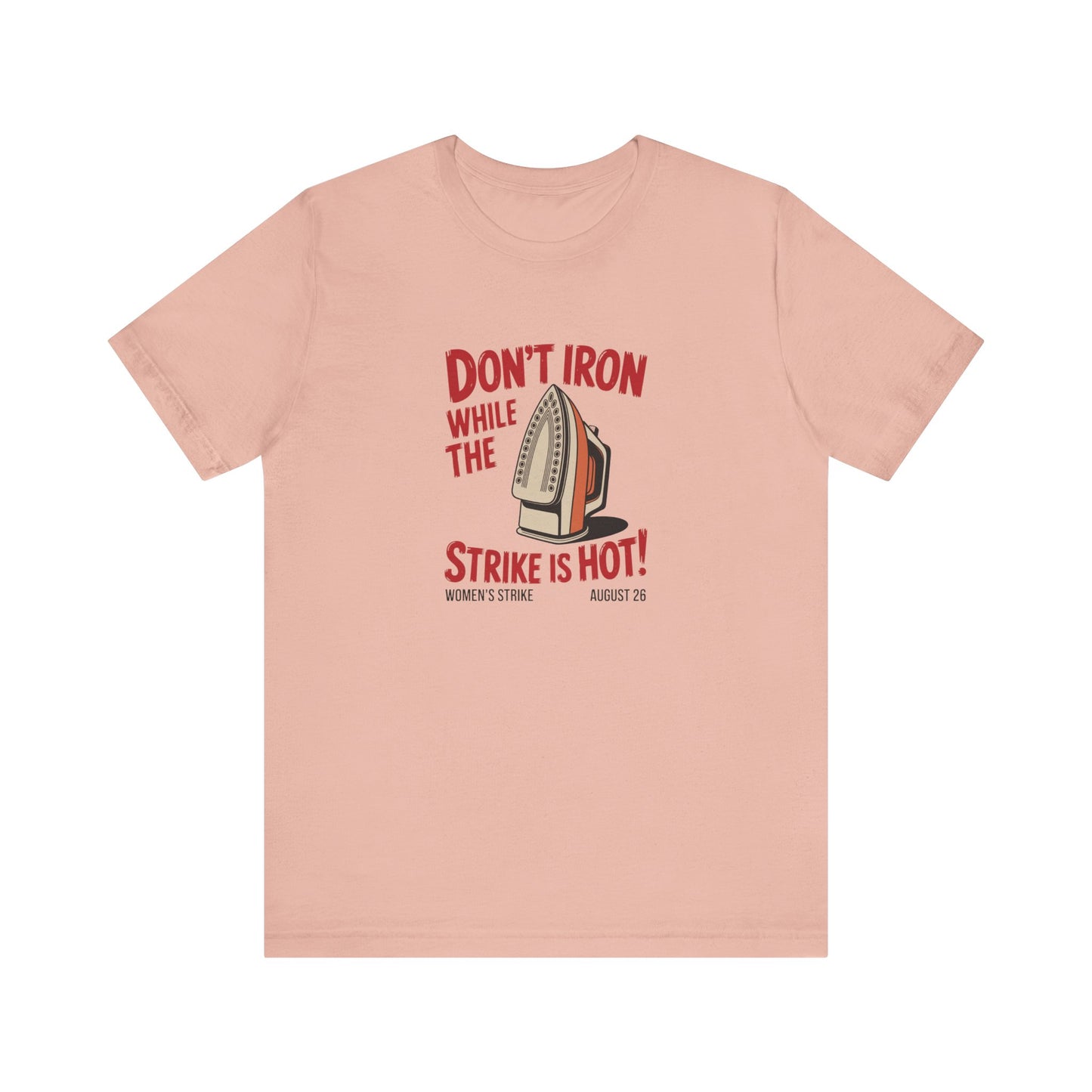 Pink t-shirt with a vintage iron graphic and red text "don't iron while the strike is hot" 