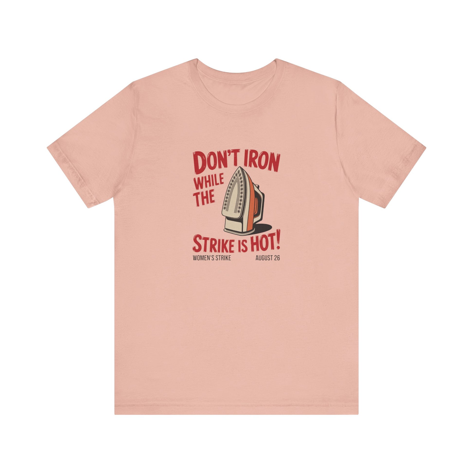 Pink t-shirt with a vintage iron graphic and red text "don't iron while the strike is hot" 