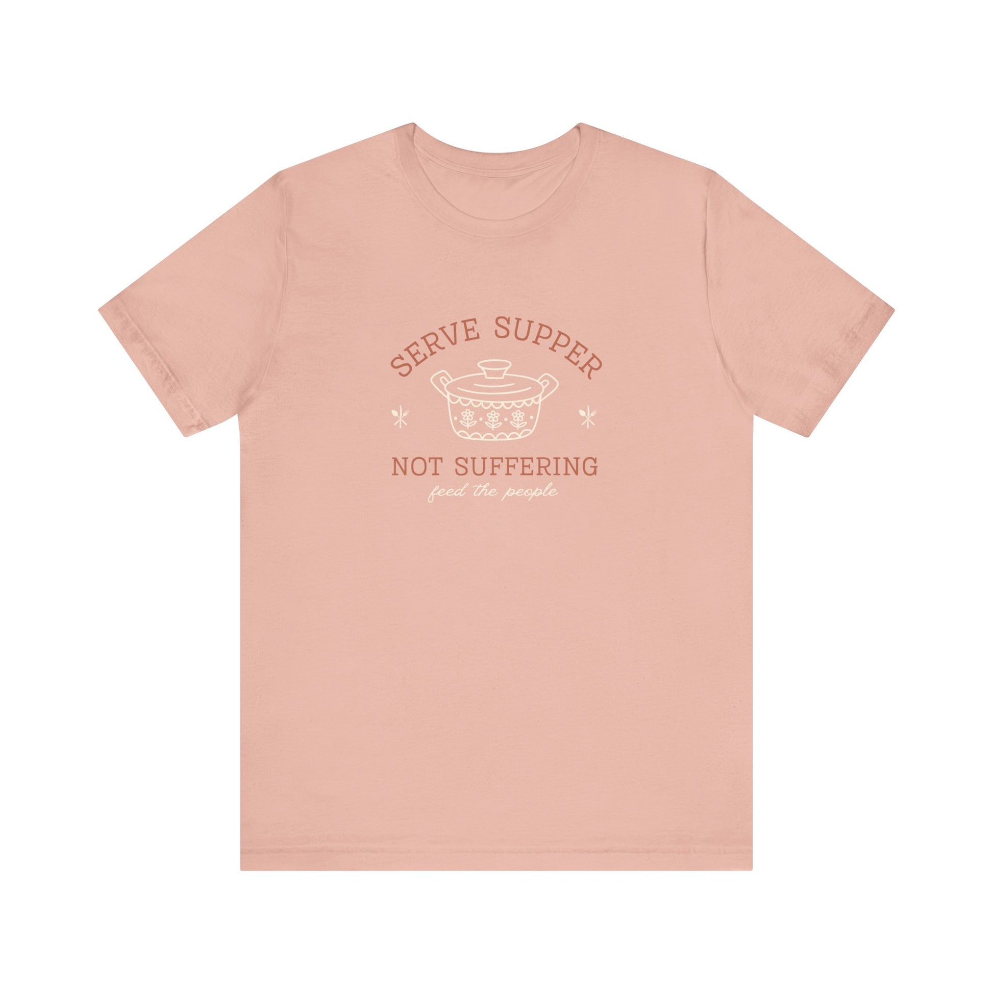 Pink t-shirt with vintage pyrex illustrated graphic and dark orange and white text "serve supper not suffering; feed the people"