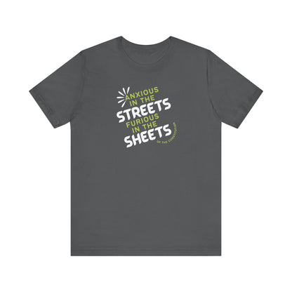 Gray t-shirt with white and green text "anxious in the streets, furious in the sheets (of the constitution)"