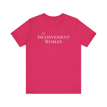 Hot pink t-shirt with white text "An Inconvenient Woman"