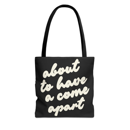Black tote bag with "about to have a come apart" in cream text