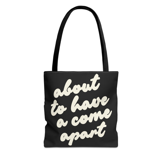Black tote bag with "about to have a come apart" in cream text