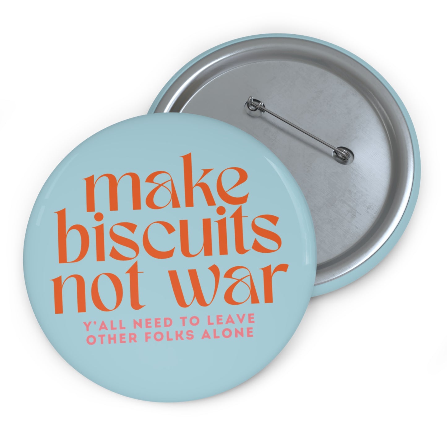 Light blue button with 'make biscuits not war' orange text and smaller pink text "y'all need to leave other folks alone"