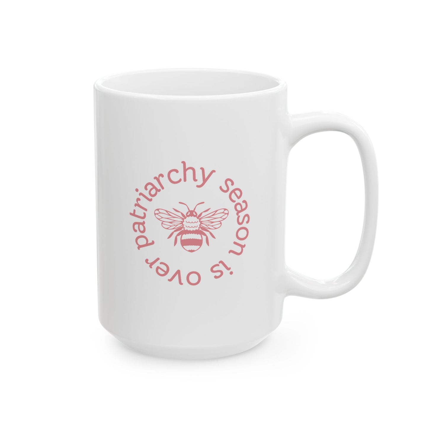 White ceramic 15 oz coffee or tea mug with pink "patriarchy season is over" text circling around a queen bee graphic 
