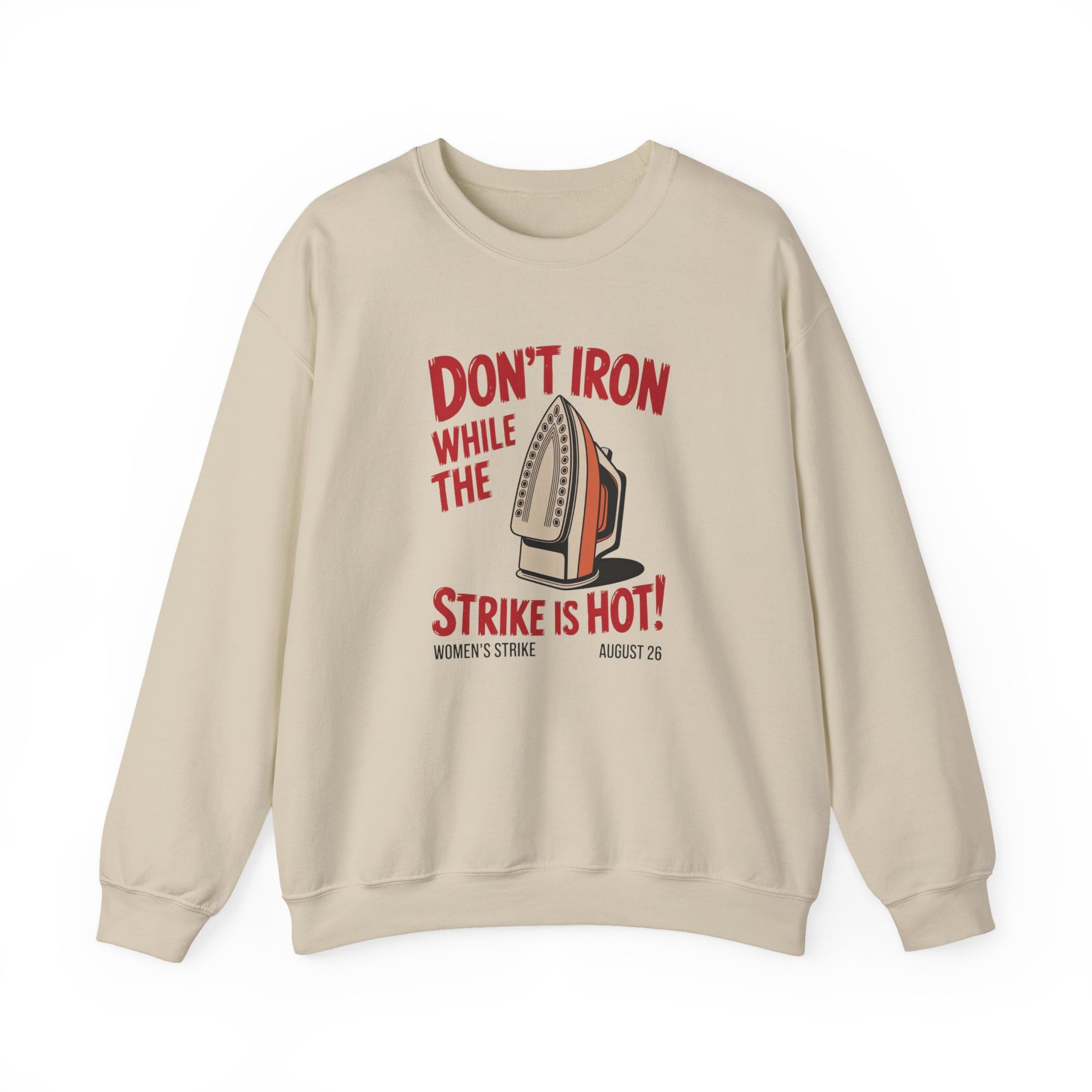 Beige unisex crewneck sweatshirt with "don't iron while the strike is hot" red text and a vintage iron graphic