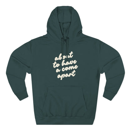 Dark teal hoodie with "about to have a come apart" in cream text