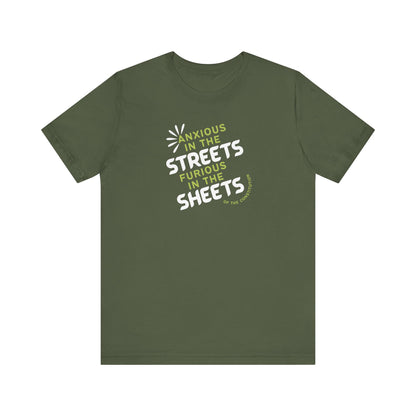 Military green t-shirt with white and green text "anxious in the streets, furious in the sheets (of the constitution)"