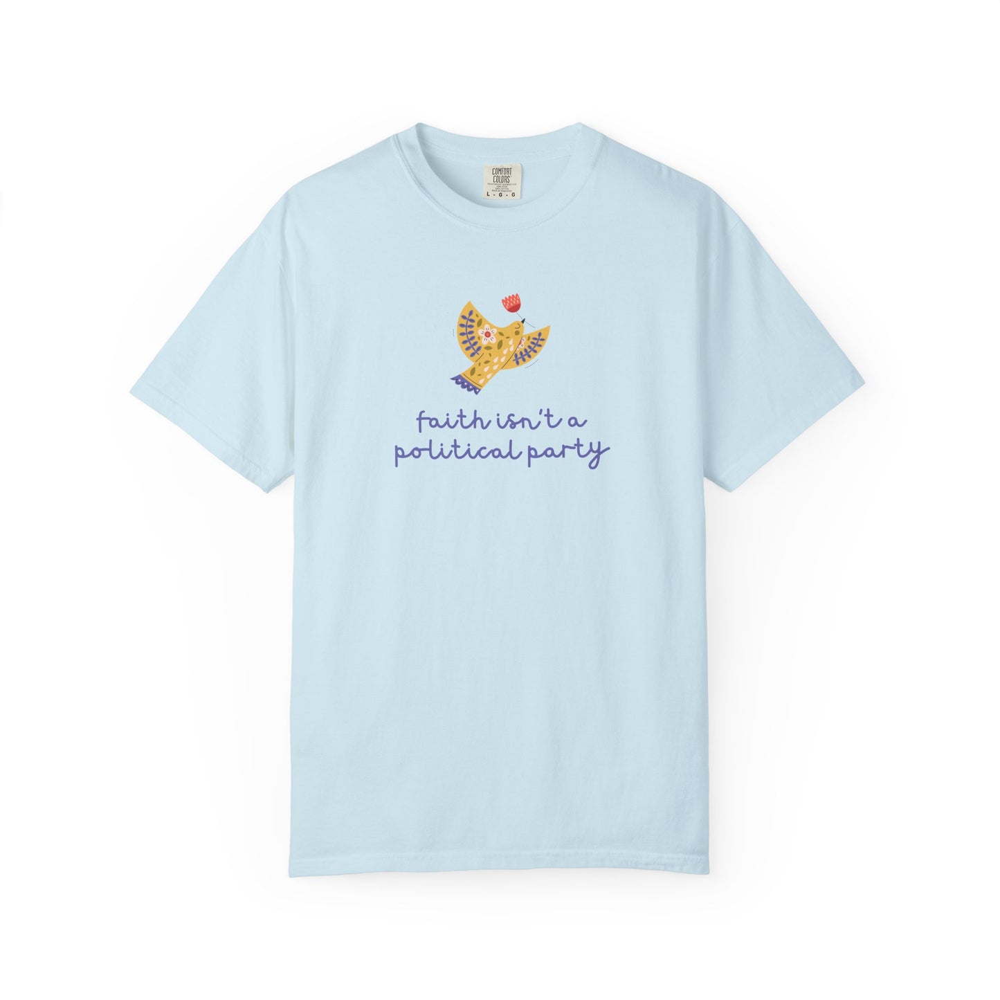 Light blue t-shirt with a folk art dove graphic and purple text "faith isn't a political party"