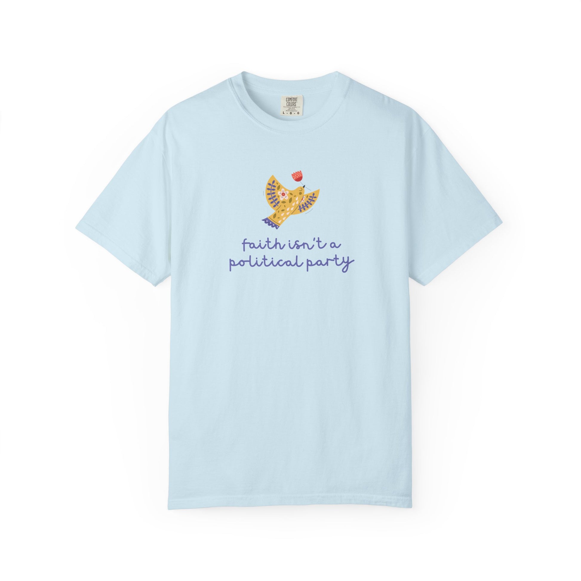 Light blue t-shirt with a folk art dove graphic and purple text "faith isn't a political party"