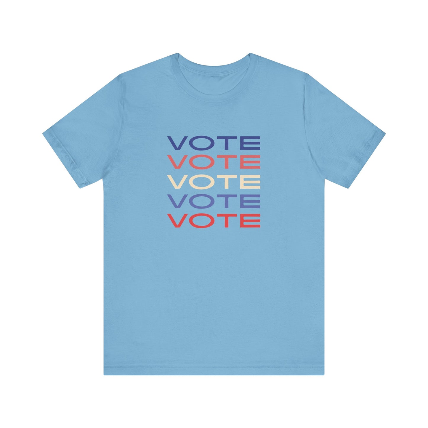 A blue short-sleeve crewneck t-shirt featuring a stacked graphic print of the word 'VOTE' in blue, red, and cream on the chest.