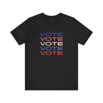 A black short-sleeve crewneck t-shirt featuring a stacked graphic print of the word 'VOTE' in blue, red, and cream on the chest.