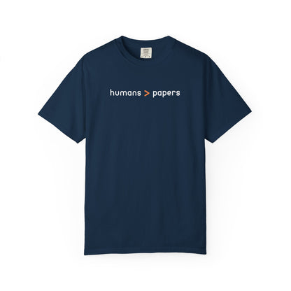 Navy blue t-shirt with white and orange 'humans > papers' text 