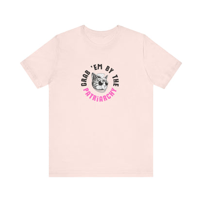 Pink t-shirt with punk rock graphic design and black and hot pink text "grab 'em by the patriarchy"